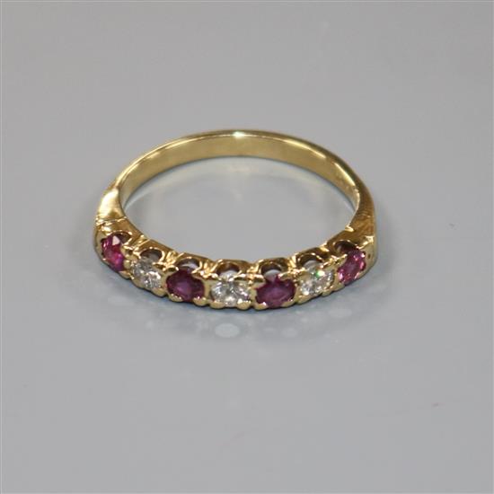 An 18ct gold, seven stone ruby and diamond half hoop ring, size P/Q.